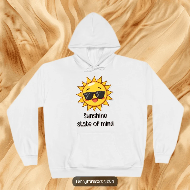 Funny hoodie showing a sun character wearing sunglasses and beaming with exaggerated joy, offering warmth and cheerful, humorous comfort.