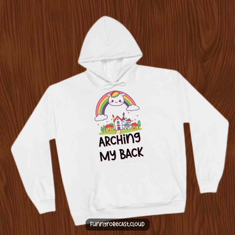 Funny kawaii rainbow arching cheerfully over a small, smiling town, featured on a soft and cozy hoodie.