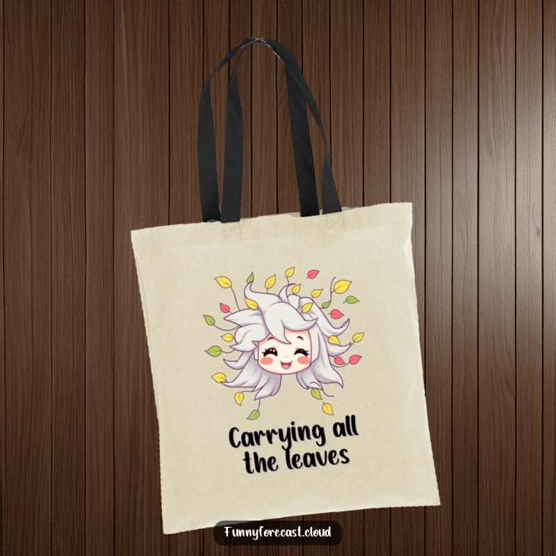 Funny tote bag showcasing a smiling wind character blowing a stream of playful, swirling leaves, a practical and cute accessory.